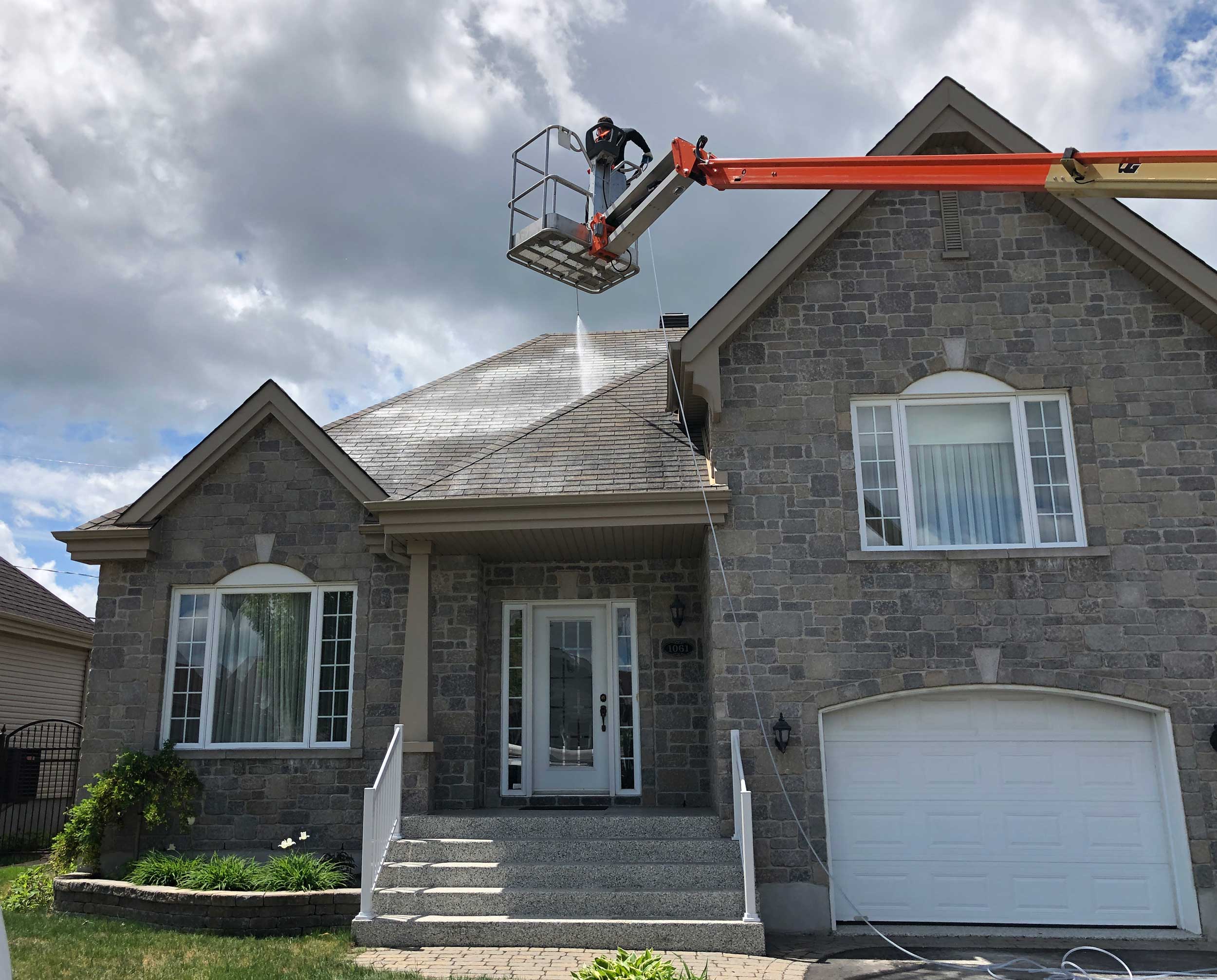 Battle Born crew applying a nano coating to a roof from a boom lift
