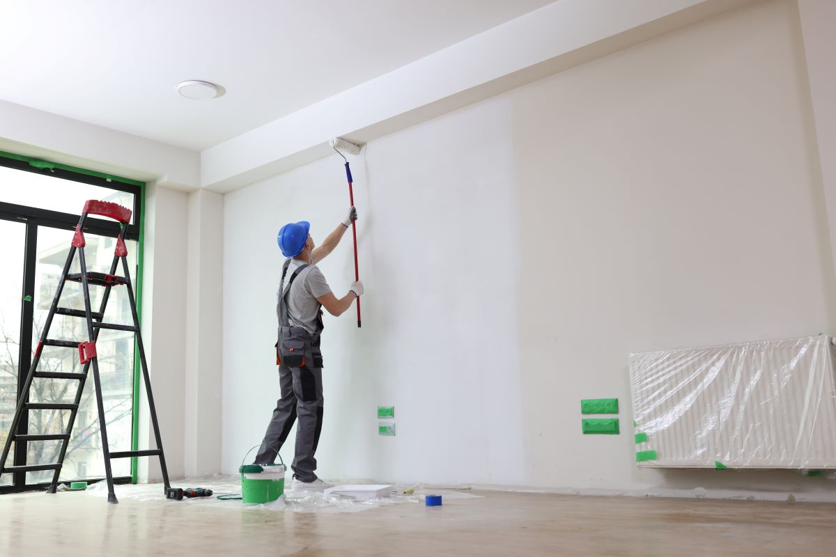 Painter painting interior walls with a roller in Reno, Nevada