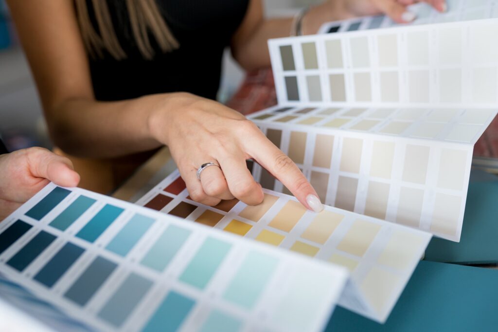 Woman browsing 2024 painting trends palate of painting colors