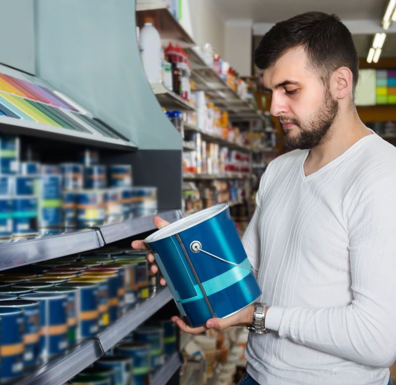 Man picking out premium paint in Reno, Nevada