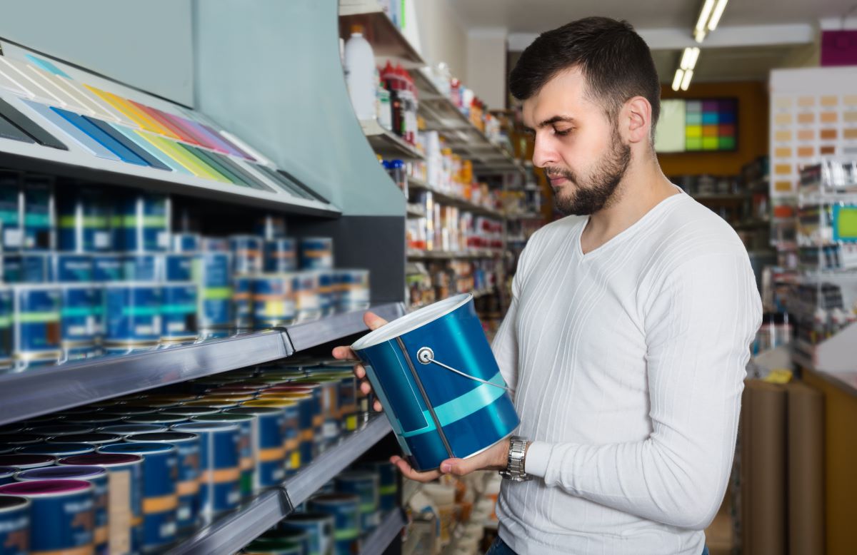 Man picking out premium paint in Reno, Nevada