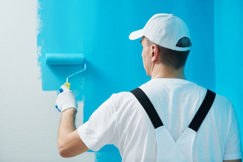 Professional painter applying fresh paint on a wall in Reno, NV.
